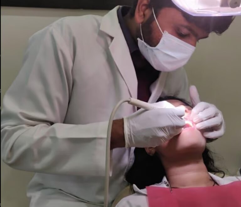 Dr. Shajith Sreeji treating a patient at Glint Dental, Bangalore